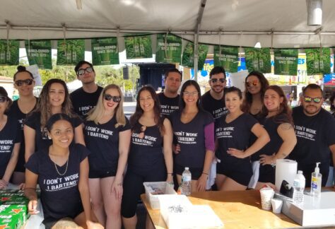 Graduate bartenders posing together before the Calle Ocho Festival.