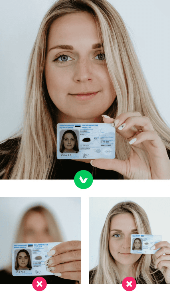 The woman is holding up her ID card and helping her change her zip code or phone number.