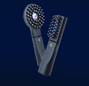 Two black hand-held hair tools "Denkibari Brush 2.0 + Body" are on display on a dark blue background. It has an innovative design with a circular head and the other with a rectangular head, which won the BODY AWARD 2022.