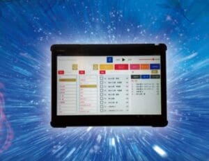 The tablet, which displays a user interface with various buttons and checklists, is installed on a blue star-shaped background and provides tools for remote sound healing.