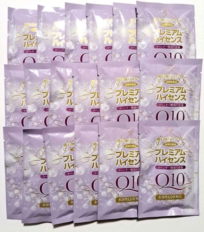 Multiple packs of skin care products labeled with Japanese letters and Q10 with medicinal bath salts arranged in a lattice on a flat surface.