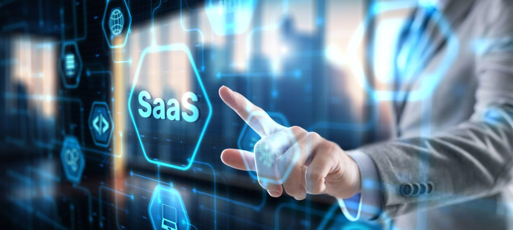 SaaS software as a service concept with hand pressing a button.